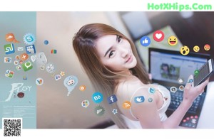 A woman laying on a bed with social media icons around her.