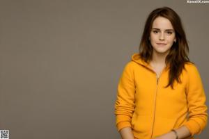 A woman in a striped shirt is posing for a picture.