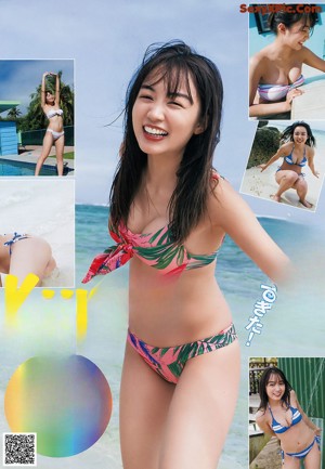 A woman in a yellow and black bathing suit posing for a picture.