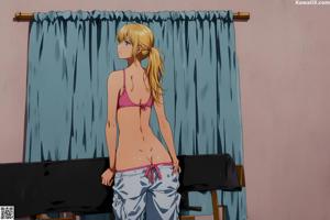 A woman in a blue lingerie leaning against a window.