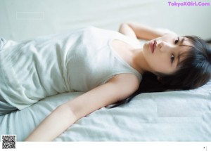 A magazine with a picture of a woman in a white dress.